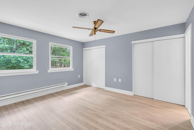 14A Portsmouth St, Whiting, NJ 08759 - unfurnished bedroom with two closets, a baseboard radiator, light wood-style floors, and ceiling fan