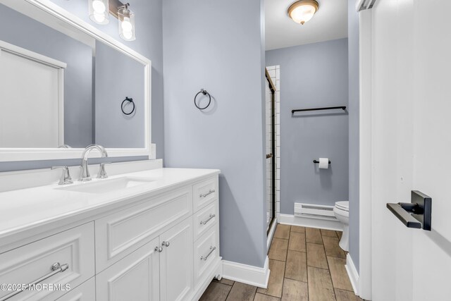 14A Portsmouth St, Whiting, NJ 08759 - full bathroom featuring baseboard heating, vanity, a shower stall, and wood tiled floors