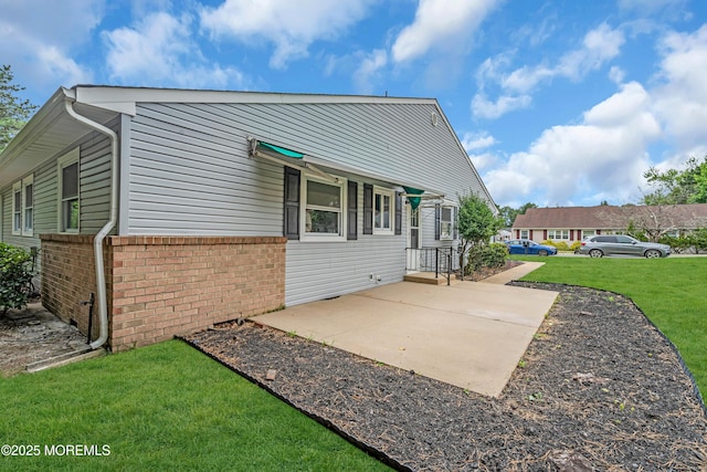 14A Portsmouth St, Whiting, NJ 08759 - rear view of property with brick siding and a lawn