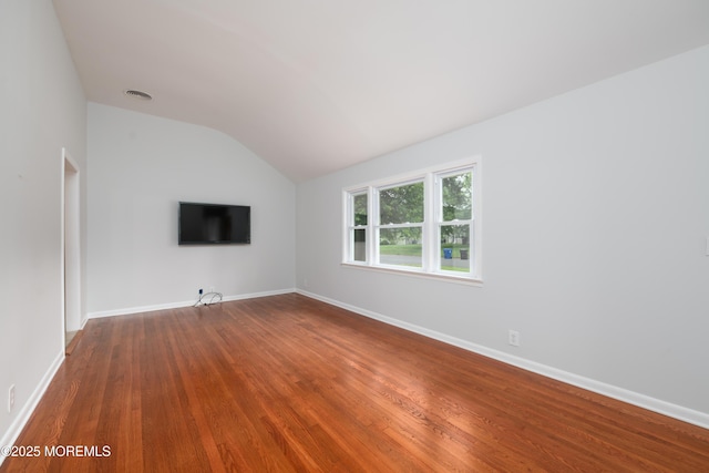 35 Fairview Dr, Middletown, NJ 07748 - unfurnished living room with vaulted ceiling and dark wood-style floors