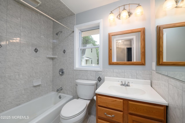 35 Fairview Dr, Middletown, NJ 07748 - bathroom featuring tile walls, washtub / shower combination, and vanity