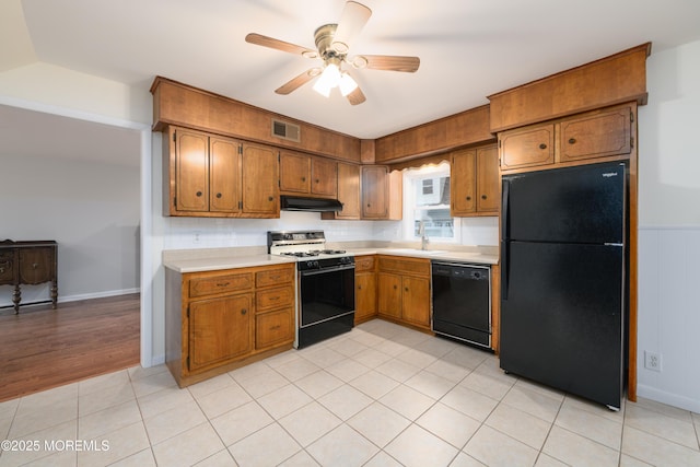 35 Fairview Dr, Middletown, NJ 07748 - kitchen with black appliances, under cabinet range hood, light countertops, brown cabinets, and a ceiling fan