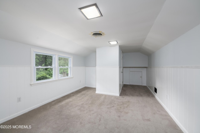 35 Fairview Dr, Middletown, NJ 07748 - additional living space with vaulted ceiling, a wainscoted wall, and carpet floors