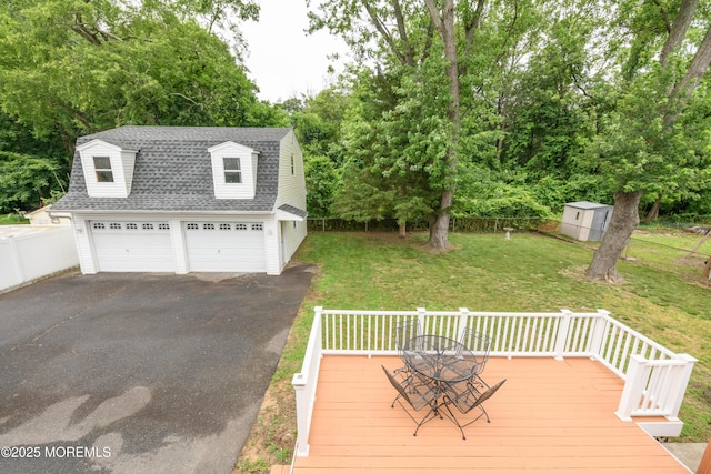35 Fairview Dr, Middletown, NJ 07748 - wooden terrace with a shed, view of wooded area, and a detached garage