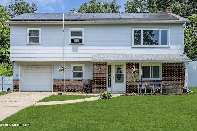 886 Stafford Dr, Toms River, NJ 08753 - view of front of house featuring brick siding, roof mounted solar panels, a chimney, and a garage