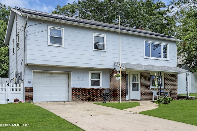 886 Stafford Dr, Toms River, NJ 08753 - view of property with brick siding, a garage, concrete driveway, and cooling unit