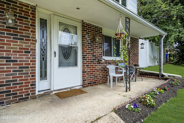 886 Stafford Dr, Toms River, NJ 08753 - doorway to property with a porch and brick siding