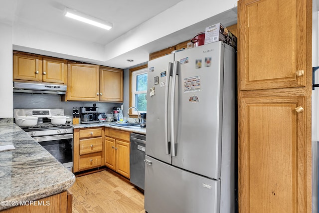 886 Stafford Dr, Toms River, NJ 08753 - kitchen featuring stainless steel appliances, under cabinet range hood, light wood-style flooring, and light stone countertops