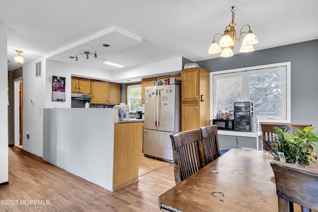 886 Stafford Dr, Toms River, NJ 08753 - kitchen featuring freestanding refrigerator, a chandelier, light wood finished floors, under cabinet range hood, and black microwave