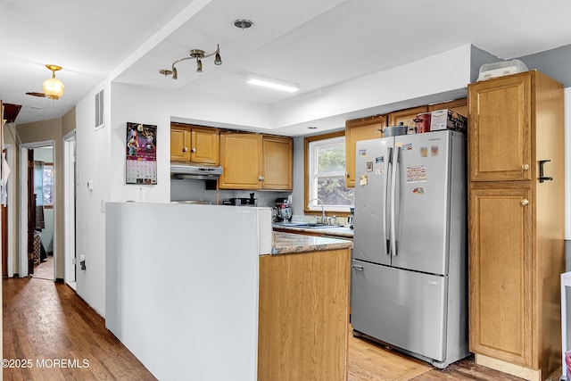 886 Stafford Dr, Toms River, NJ 08753 - kitchen featuring freestanding refrigerator, light wood finished floors, under cabinet range hood, and brown cabinetry