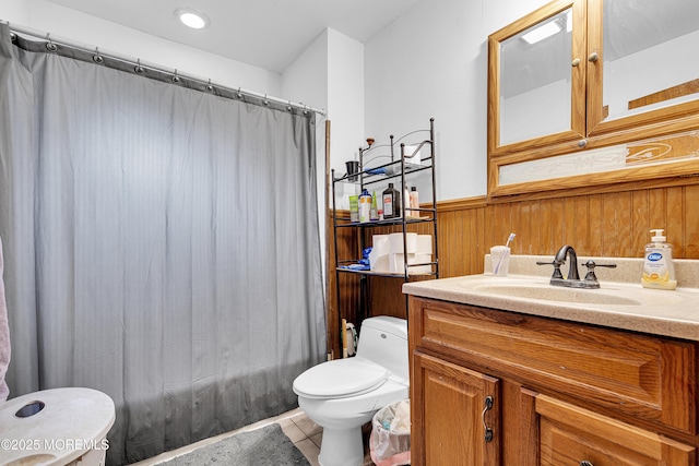886 Stafford Dr, Toms River, NJ 08753 - full bathroom featuring tile patterned flooring, vanity, wainscoting, wooden walls, and shower / bathtub combination with curtain