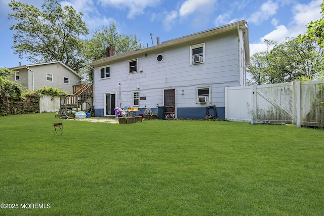 886 Stafford Dr, Toms River, NJ 08753 - back of property with a fenced backyard, a chimney, stairs, and a gate