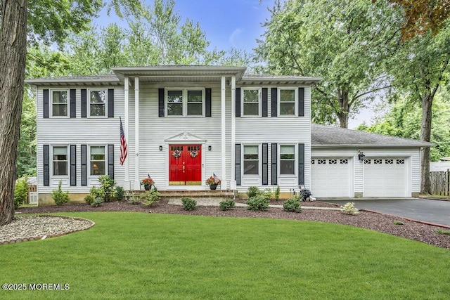 19 Bartlett Ct, Matawan, NJ 07747 - view of front of house with asphalt driveway, an attached garage, and a front yard
