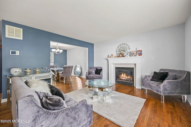 18 4th Ave, Toms River, NJ 08757 - living area with a chandelier, a glass covered fireplace, and wood finished floors
