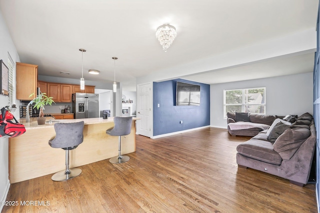 18 4th Ave, Toms River, NJ 08757 - kitchen with stainless steel fridge, open floor plan, wood finished floors, and light countertops
