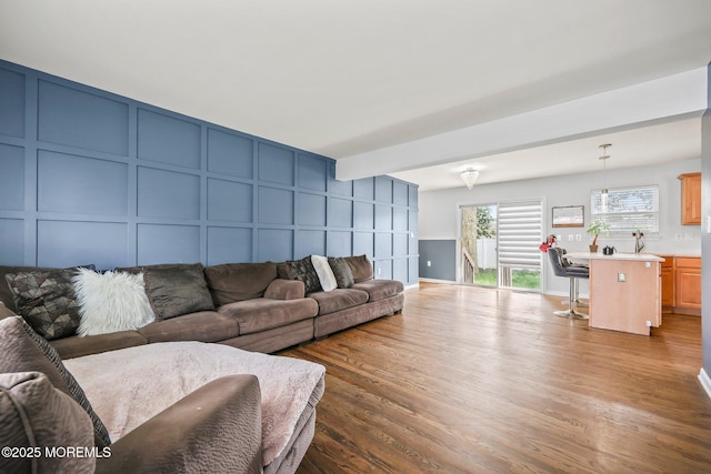 18 4th Ave, Toms River, NJ 08757 - living room featuring a decorative wall, wood finished floors, and beamed ceiling
