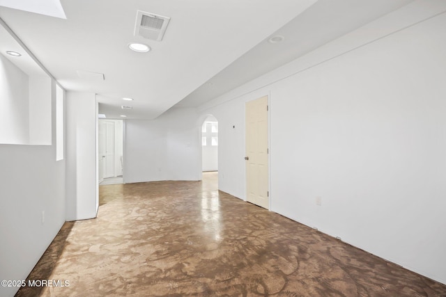 18 4th Ave, Toms River, NJ 08757 - spare room featuring arched walkways, finished concrete floors, and recessed lighting
