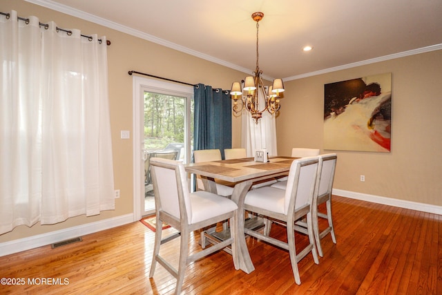 45 Sugar Hill Rd, Manahawkin, NJ 08050 - dining area featuring a chandelier, light wood finished floors, crown molding, and recessed lighting