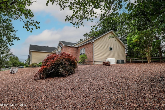 45 Sugar Hill Rd, Manahawkin, NJ 08050 - view of property exterior with a central AC unit and brick siding