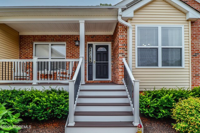 45 Sugar Hill Rd, Manahawkin, NJ 08050 - property entrance featuring brick siding and a porch