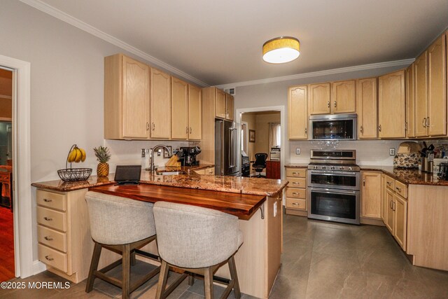 45 Sugar Hill Rd, Manahawkin, NJ 08050 - kitchen featuring appliances with stainless steel finishes, a peninsula, ornamental molding, light brown cabinets, and a breakfast bar