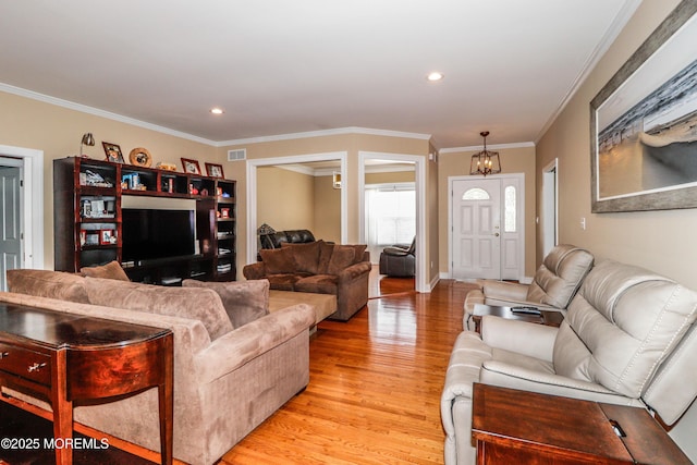45 Sugar Hill Rd, Manahawkin, NJ 08050 - living area featuring light wood-style flooring, a chandelier, ornamental molding, and recessed lighting