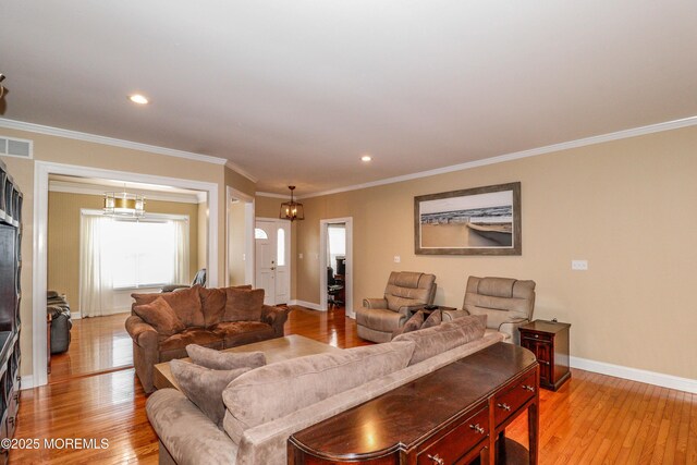 45 Sugar Hill Rd, Manahawkin, NJ 08050 - living room featuring light wood-type flooring, ornamental molding, a chandelier, and recessed lighting