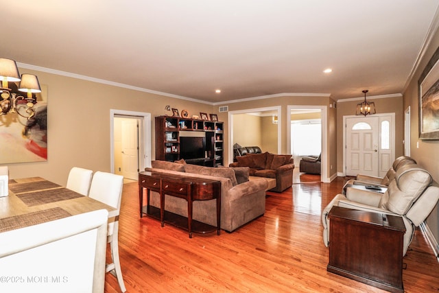 45 Sugar Hill Rd, Manahawkin, NJ 08050 - living room featuring light wood-style floors, a chandelier, crown molding, and recessed lighting