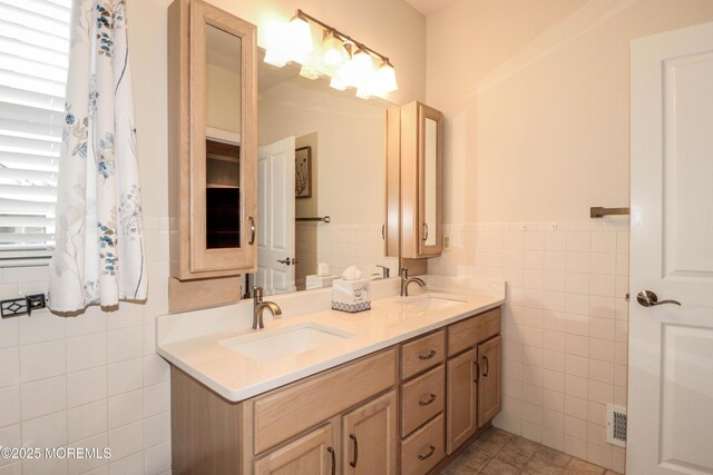 45 Sugar Hill Rd, Manahawkin, NJ 08050 - full bathroom with tile walls, double vanity, wainscoting, and tile patterned flooring