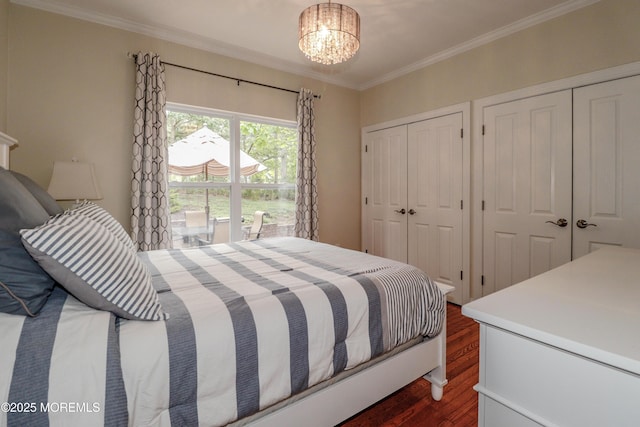 45 Sugar Hill Rd, Manahawkin, NJ 08050 - bedroom featuring dark wood-type flooring, crown molding, two closets, and a chandelier