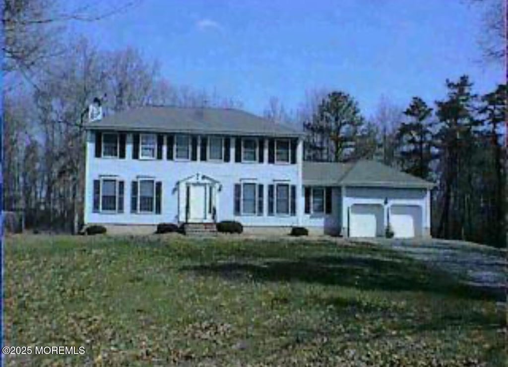 10 Brentwood Dr, Jackson, NJ 08527 - colonial house with an attached garage and entry steps