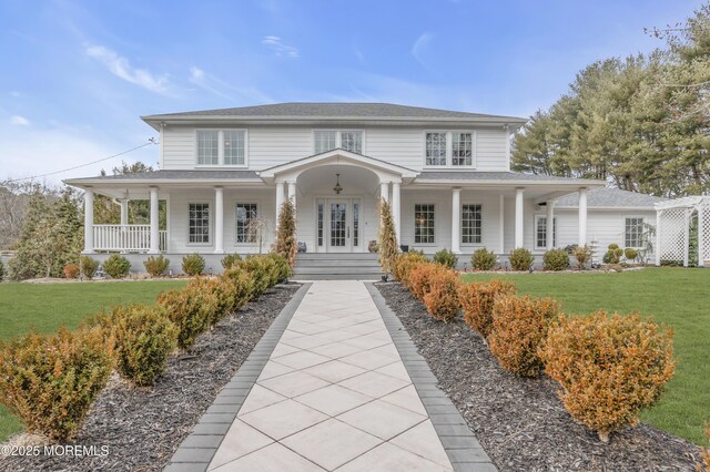 15 E Pine Branch Dr, Millstone, NJ 08510 - view of front of home featuring a porch and a front yard