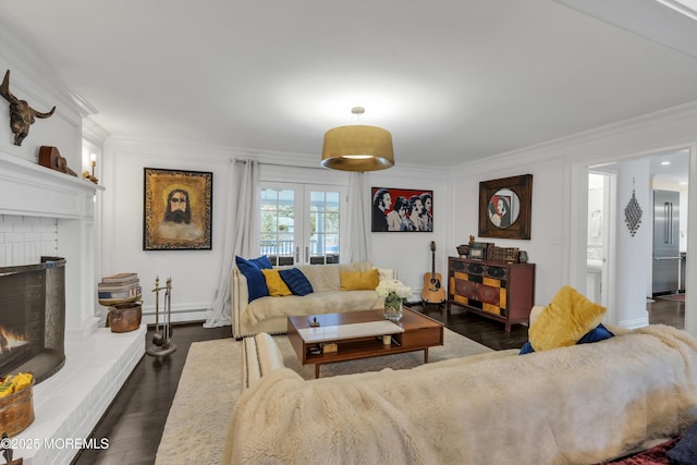 15 E Pine Branch Dr, Millstone, NJ 08510 - living room featuring crown molding, a baseboard heating unit, a brick fireplace, and dark wood-style flooring