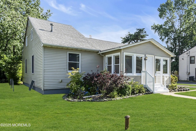 626 Clark Ave, Union Beach, NJ 07735 - view of front of house with roof with shingles, a front lawn, and entry steps
