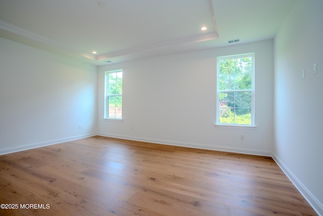 15 Ashlynn Ct, Manalapan, NJ 07726 - empty room with a raised ceiling, light wood-type flooring, crown molding, and recessed lighting