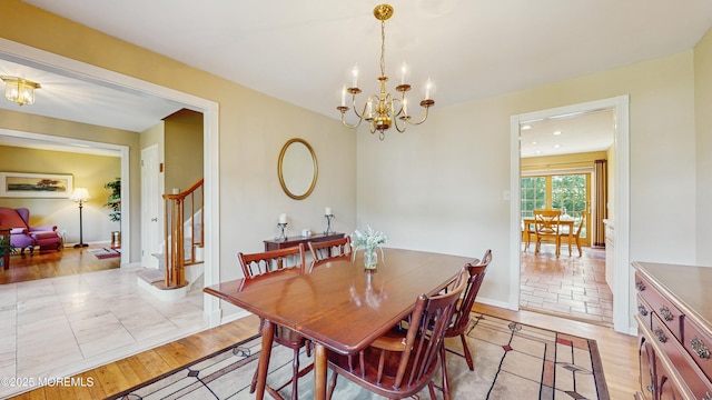 26 Appomattox Dr, Manalapan, NJ 07726 - dining room with light wood finished floors, a chandelier, and stairway