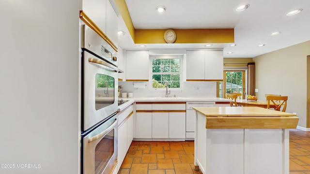 26 Appomattox Dr, Manalapan, NJ 07726 - kitchen featuring dishwasher, stainless steel double oven, white cabinets, recessed lighting, and a center island