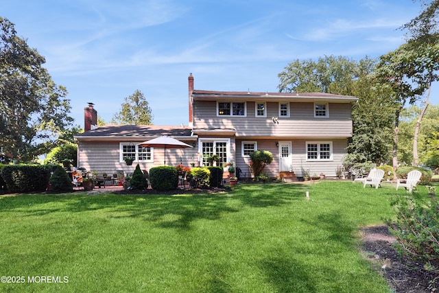 26 Appomattox Dr, Manalapan, NJ 07726 - back of property featuring entry steps, a yard, and a chimney