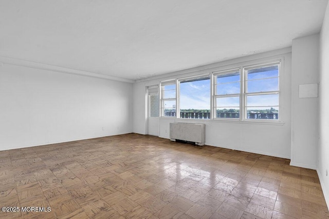 510 Deal Lake Dr Unit 8F, Asbury Park, NJ 07712 - empty room featuring radiator heating unit
