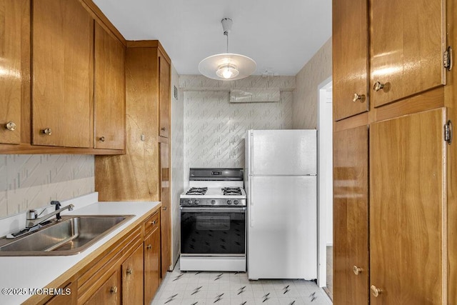 510 Deal Lake Dr Unit 8F, Asbury Park, NJ 07712 - kitchen featuring white appliances, brown cabinets, light countertops, and decorative light fixtures