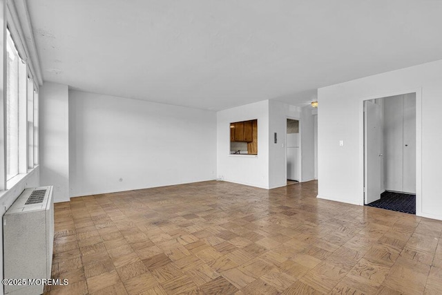 510 Deal Lake Dr Unit 8F, Asbury Park, NJ 07712 - spare room with radiator heating unit and baseboards