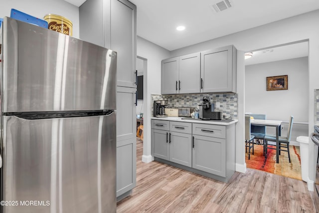 81 Falmouth Ave Unit 72, Whiting, NJ 08759 - kitchen featuring freestanding refrigerator, gray cabinets, light wood-style floors, light countertops, and recessed lighting