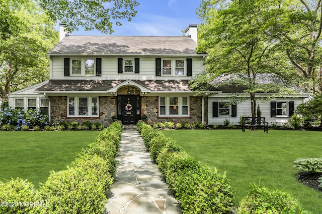 6 Buttonwood Dr, Shrewsbury Boro, NJ 07702 - view of front of home featuring a chimney, a front yard, and stone siding