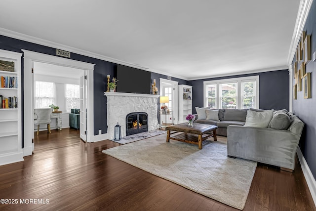 6 Buttonwood Dr, Shrewsbury Boro, NJ 07702 - living area featuring wood finished floors, crown molding, and a fireplace