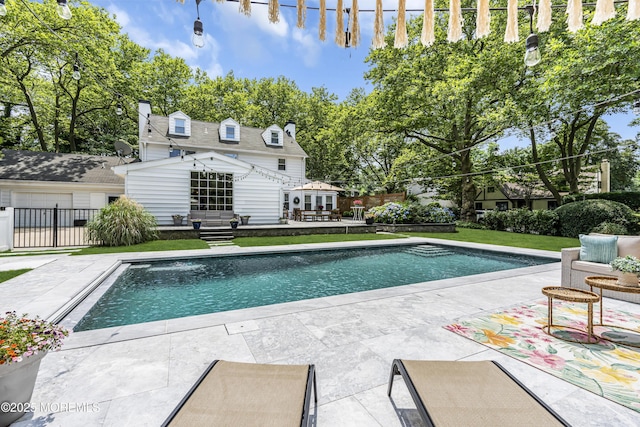 6 Buttonwood Dr, Shrewsbury Boro, NJ 07702 - swimming pool featuring an outdoor structure, a storage structure, and a patio area