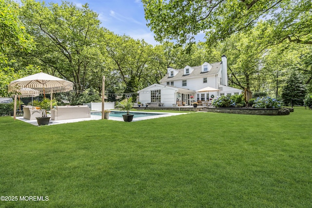 6 Buttonwood Dr, Shrewsbury Boro, NJ 07702 - rear view of house with an outdoor living space, a yard, a patio, a chimney, and view of scattered trees