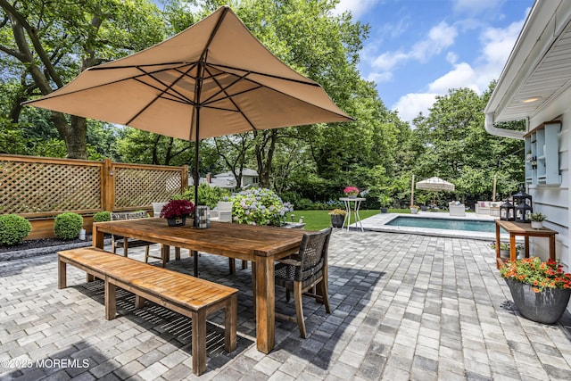 6 Buttonwood Dr, Shrewsbury Boro, NJ 07702 - view of patio / terrace with outdoor dining space, an outdoor pool, and view of wooded area