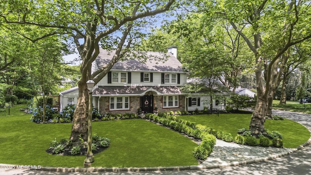 6 Buttonwood Dr, Shrewsbury Boro, NJ 07702 - traditional-style house featuring stone siding and a chimney