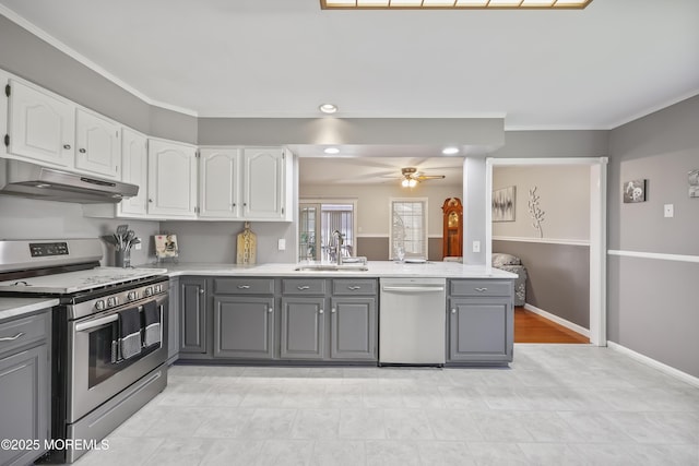 23 Norlaine Dr, Cookstown, NJ 08511 - kitchen with appliances with stainless steel finishes, gray cabinetry, under cabinet range hood, white cabinets, and crown molding