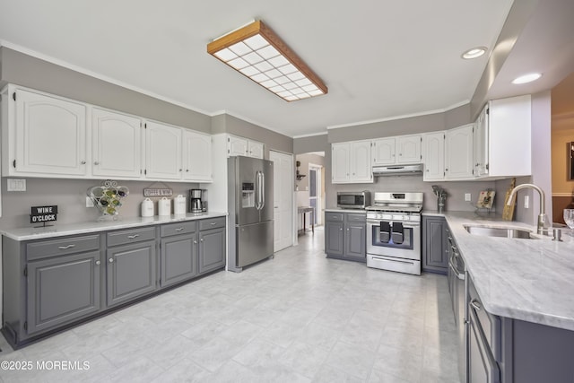 23 Norlaine Dr, Cookstown, NJ 08511 - kitchen with appliances with stainless steel finishes, gray cabinets, under cabinet range hood, ornamental molding, and white cabinetry